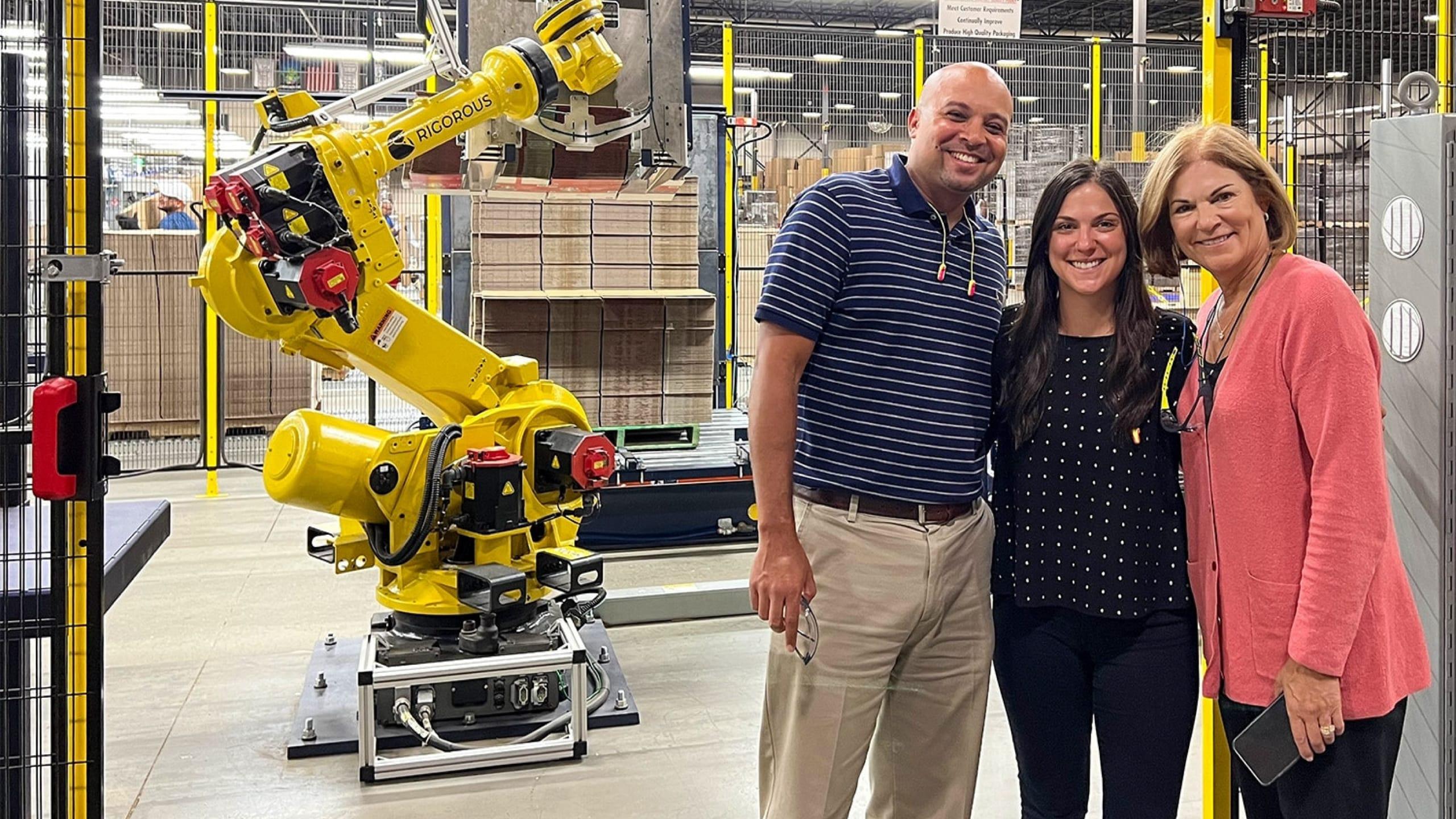 Happy Accurate Box Co. team photo showing their satisfaction for their new smart pre-feeder solution, the Box Hopper.