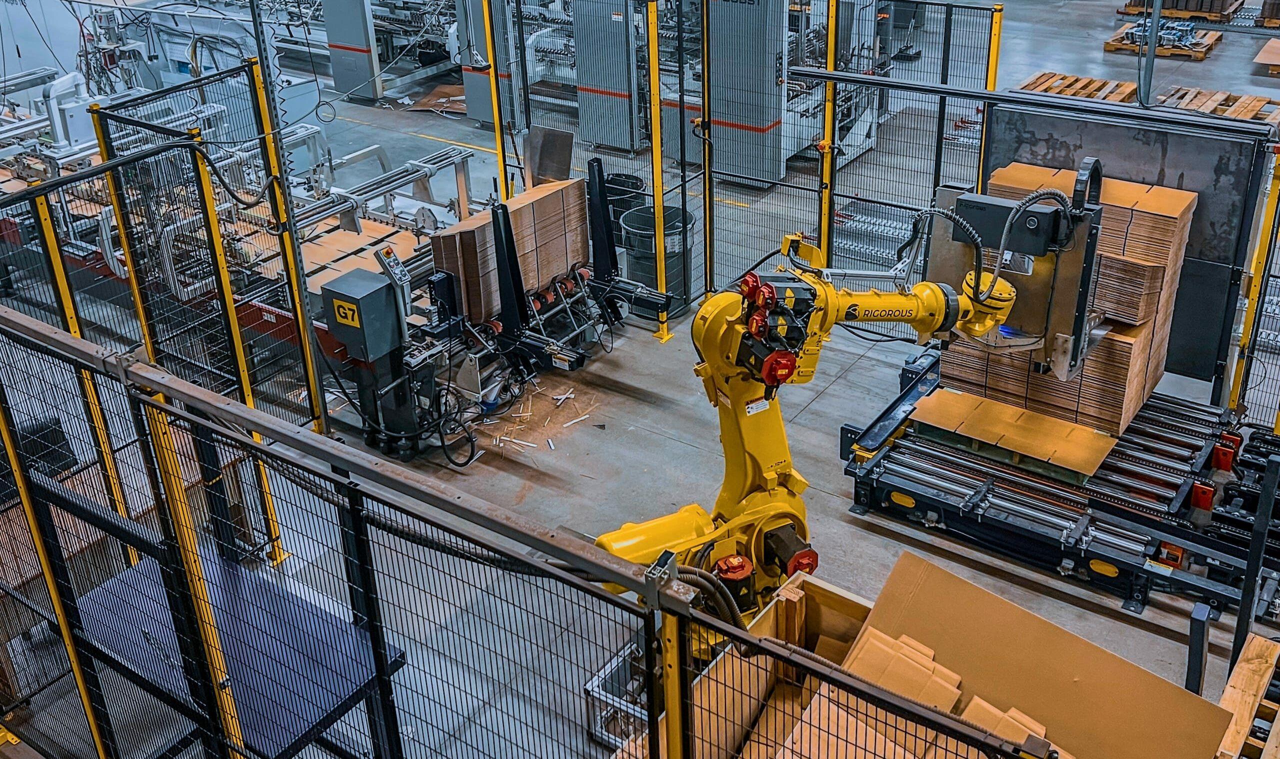 View from above of the Accurate Box Co. corrugated manufacturing line including a smart pre-feed robot.