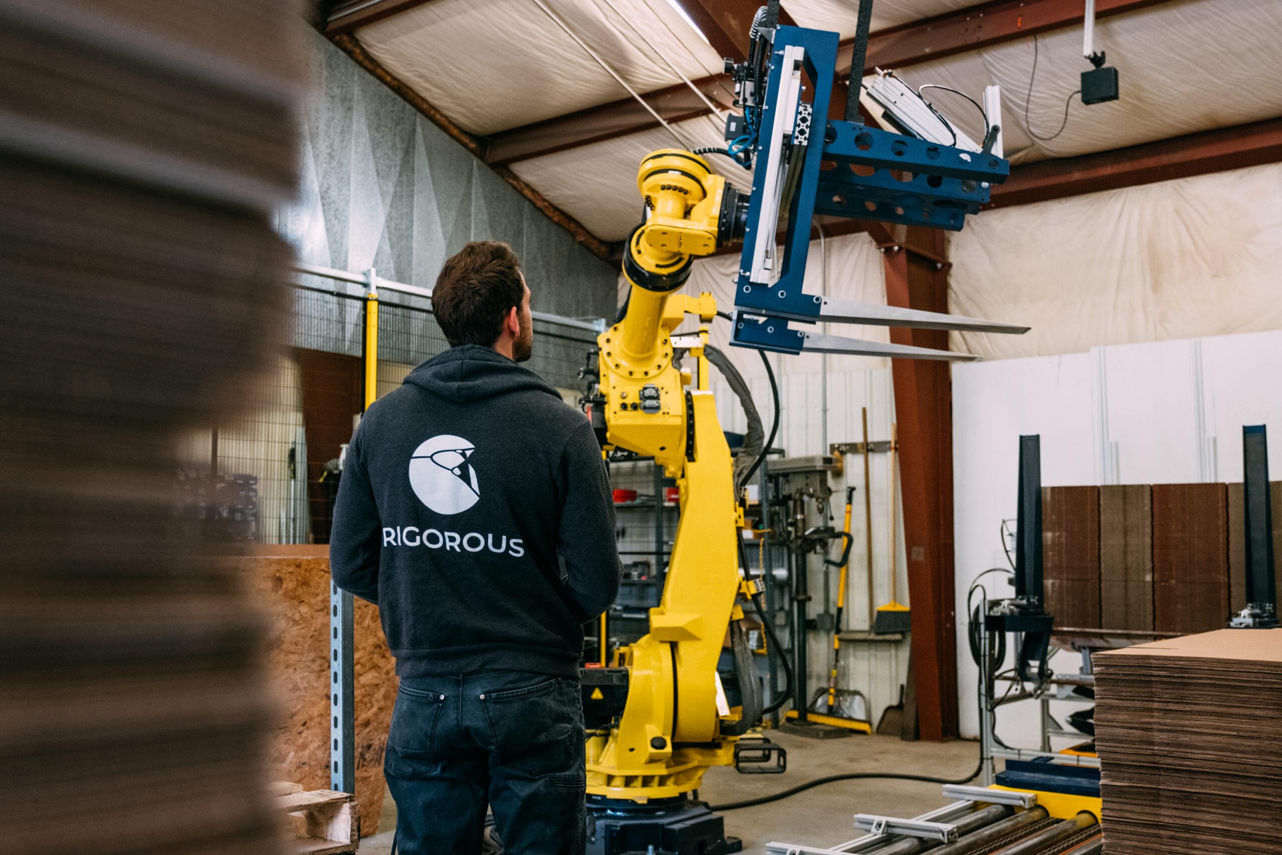 Rigorous employee working on robot.